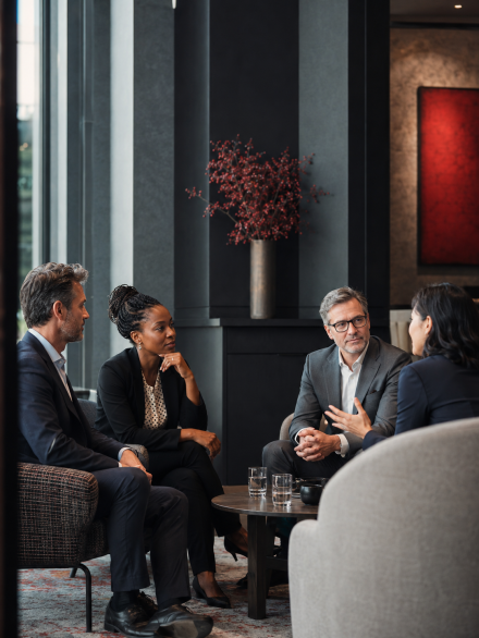 Senior professionals building strategic connections through meaningful conversation